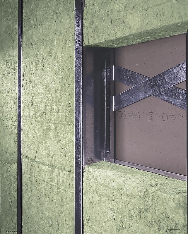 AFB batts friction-fit between steel studs in a partition wall